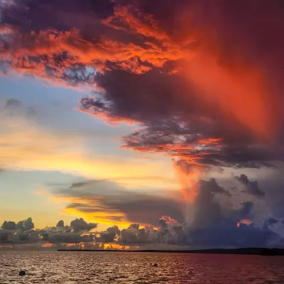 a sunset over a body of water